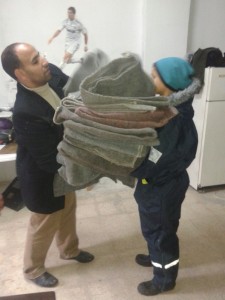 Baha collecting blankets