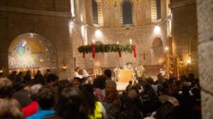 Helping the many visitors enjoy Christmas Eve Mass