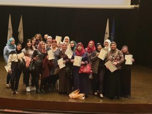 Women with their certificates
