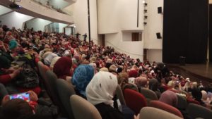 Auditorium full with graduates and families
